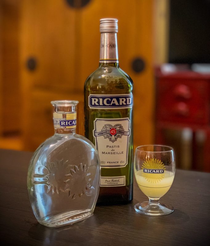 clear glass bottle beside clear drinking glass